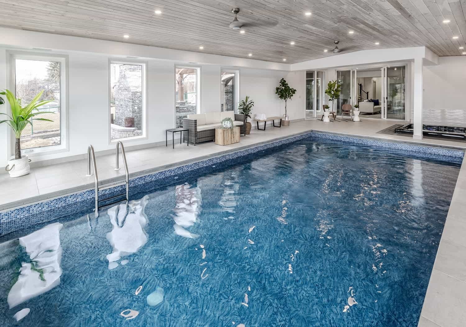 Lower-level indoor pool and spa by Kay2 Contracting on Chestermere Lake