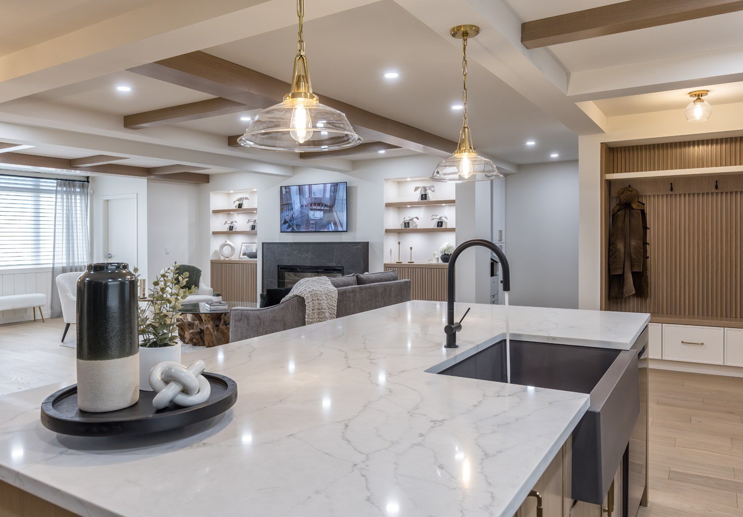 Quartz island with farmhouse sink overlooking the lounge